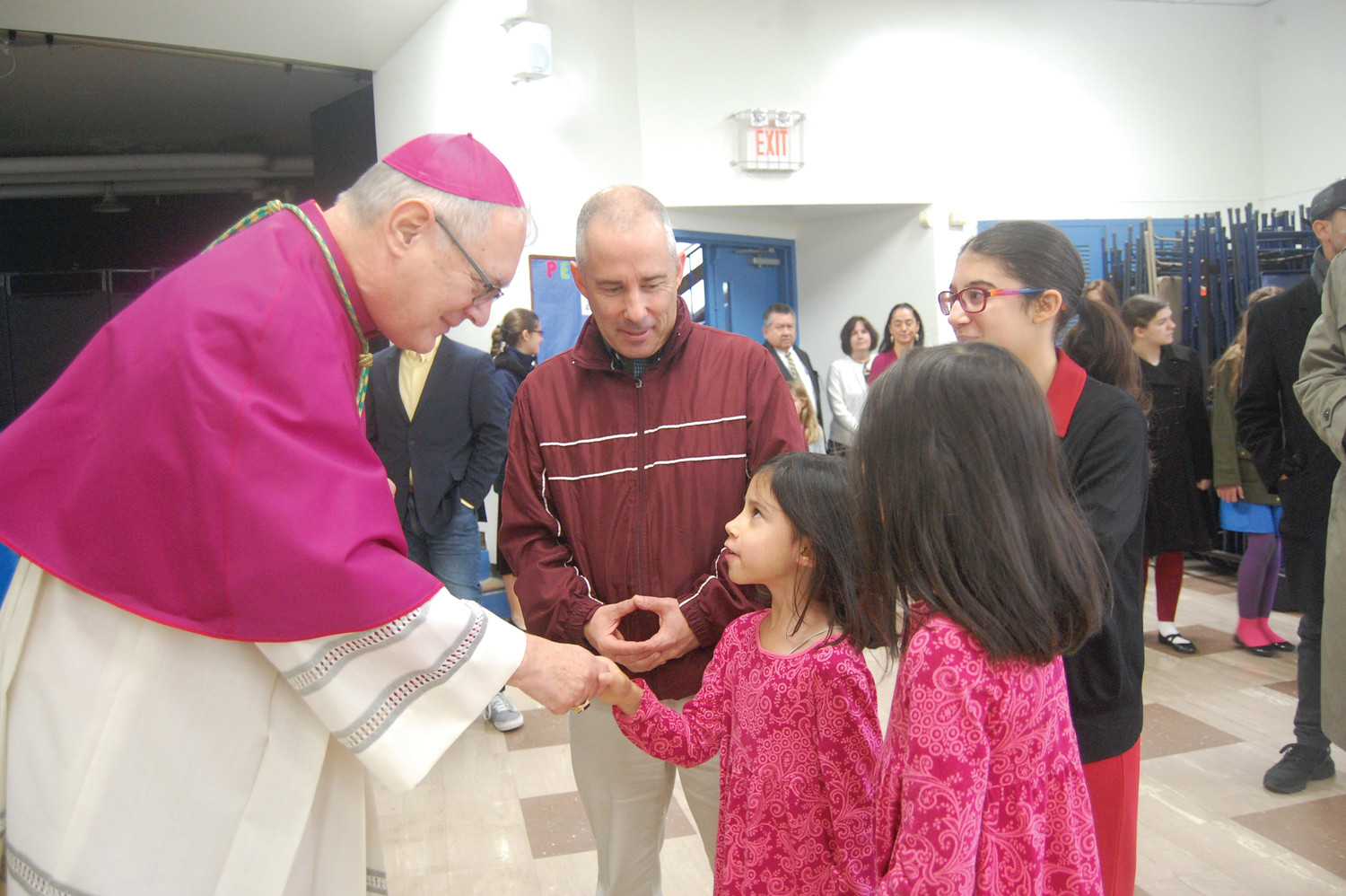 Bishop Thomas Tobin meets with parishioners during a recent visit to St. Mary’s Church on Broadway, where the Priestly Fraternity of St. Peter has assumed leadership.
